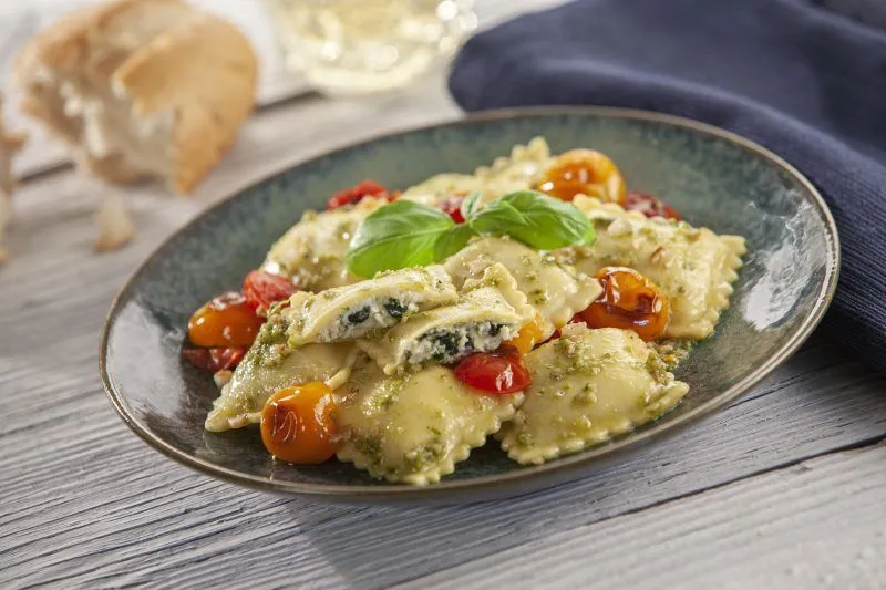 celentano spinach and cheese ravioli pesto cherry tomatoe scaled